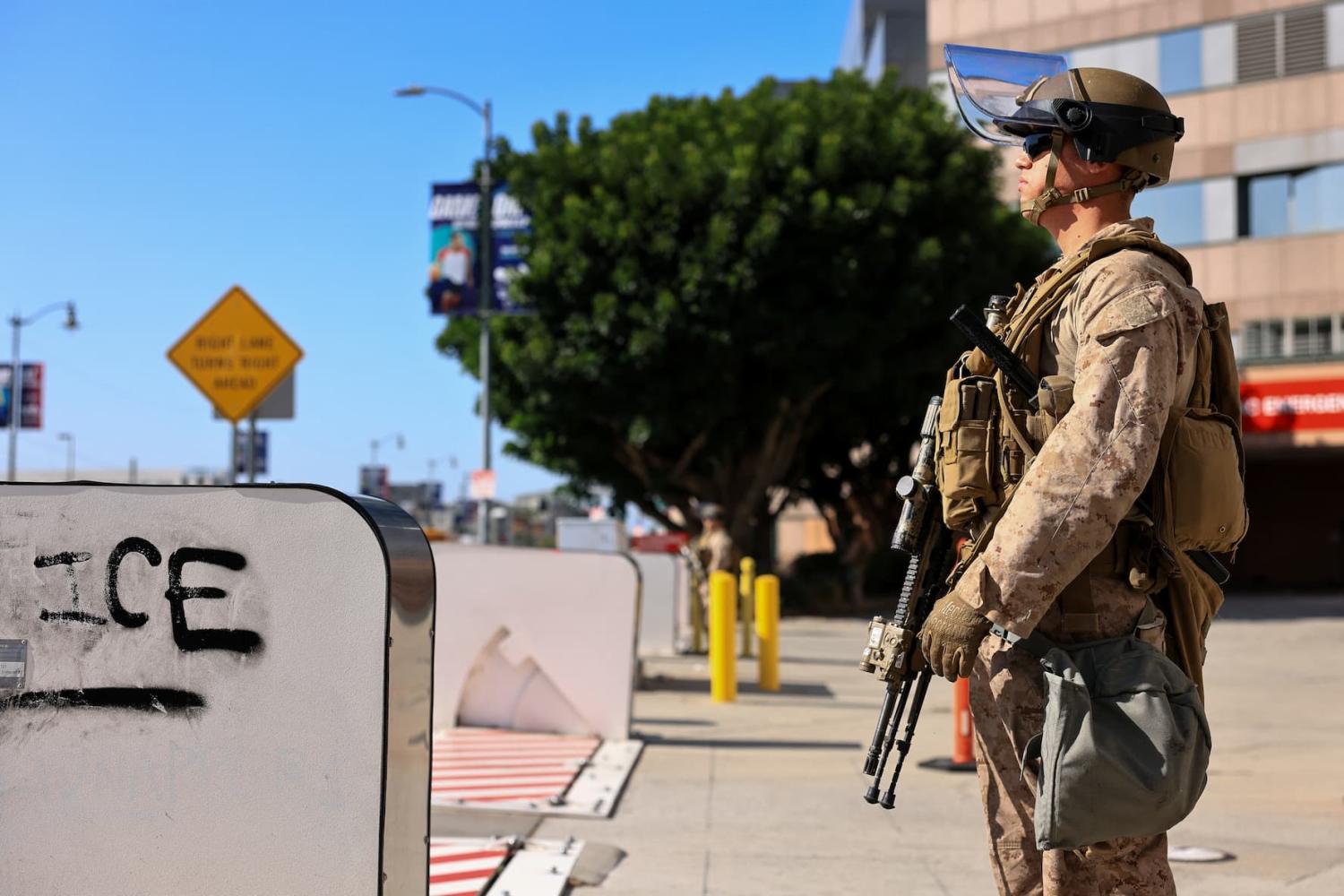A U.S. Marine stands guard outside the Edward R. Roybal Federal Building amid federal immigration sweeps, in Los Angeles, California, U.S., June 18, 2025.