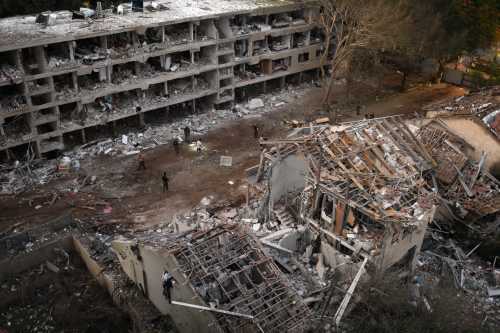 Rescue teams inspect the damage to buildings struck by an Iranian ballistic missile in Tel-Aviv, Israel, on June 22, 2025.
