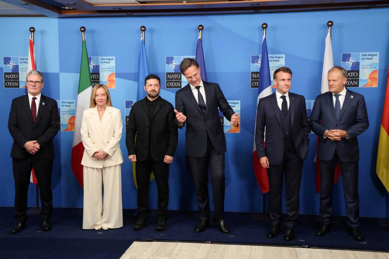 (From L) Britain's Prime Minister Keir Starmer, Italy's Prime Minister Giorgia Meloni, Ukraine's President Volodymyr Zelensky, NATO Secretary General Mark Rutte, France's President Emmanuel Macron, Poland's Prime Minister Donald Tusk and Germany's Chancellor Friedrich Merz pose within a meeting between the NATO Secretary General, the president of Ukraine, and leaders of E5 countries during a North Atlantic Treaty Organization (NATO) Heads of State and Government summit in The Hague on June 25, 2025.