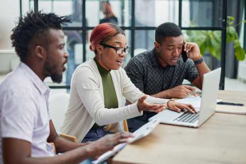 In a modern office. a diverse team of managers at a company meeting to discuss business projects.
