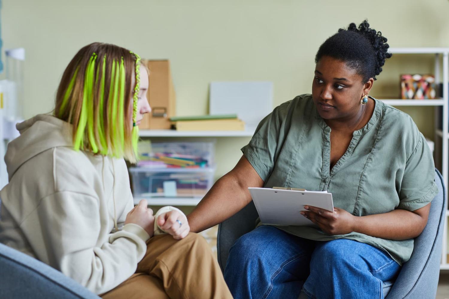 A high school teacher helps her teenage student work through a difficult situation.