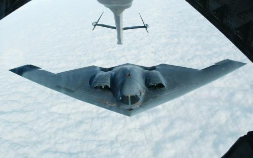The Northrop Grumman B-2 Spirit stealth bomber approaches an U.S. Air Force KC-10(A) tanker plane over the Missouri sky to receive an aerial refueling after taking off from the Whiteman Air Force Base in Johnson County, Missouri in this October 30, 2002 file photo.