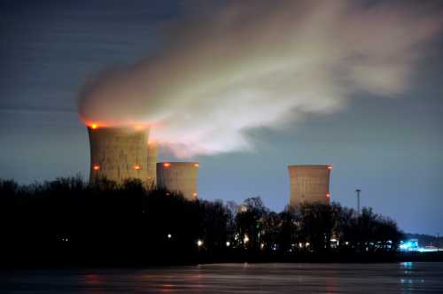 The Three Mile Island nuclear power plant, where the U.S. suffered its most serious nuclear accident in 1979, is seen across the Susquehanna River in Middletown, Pennsylvania, in this night view taken March 15, 2011. U.S. regulators should press ahead with approving construction licenses for new nuclear power plants despite Japan's nuclear crisis, President Barack Obama's top energy official Energy Secretary Steven Chu said on Tuesday. REUTERS/Jonathan Ernst
