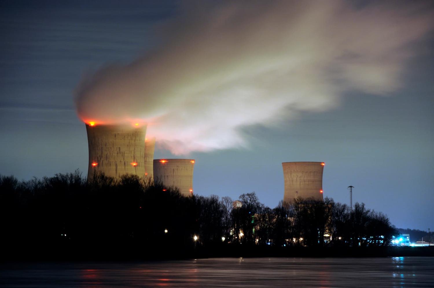 The Three Mile Island nuclear power plant, where the U.S. suffered its most serious nuclear accident in 1979, is seen across the Susquehanna River in Middletown, Pennsylvania, in this night view taken March 15, 2011. U.S. regulators should press ahead with approving construction licenses for new nuclear power plants despite Japan's nuclear crisis, President Barack Obama's top energy official Energy Secretary Steven Chu said on Tuesday. REUTERS/Jonathan Ernst