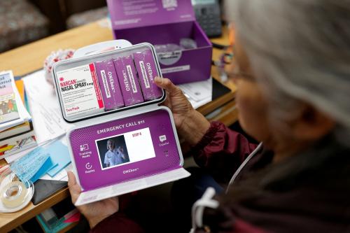 Peer support worker Julie Guerro opens an opioid overdose emergency box containing a video instruction and naloxone, at the Alamo Navajo Health Center on the Alamo Navajo reservation in Southern New Mexico, U.S., December 11, 2024.