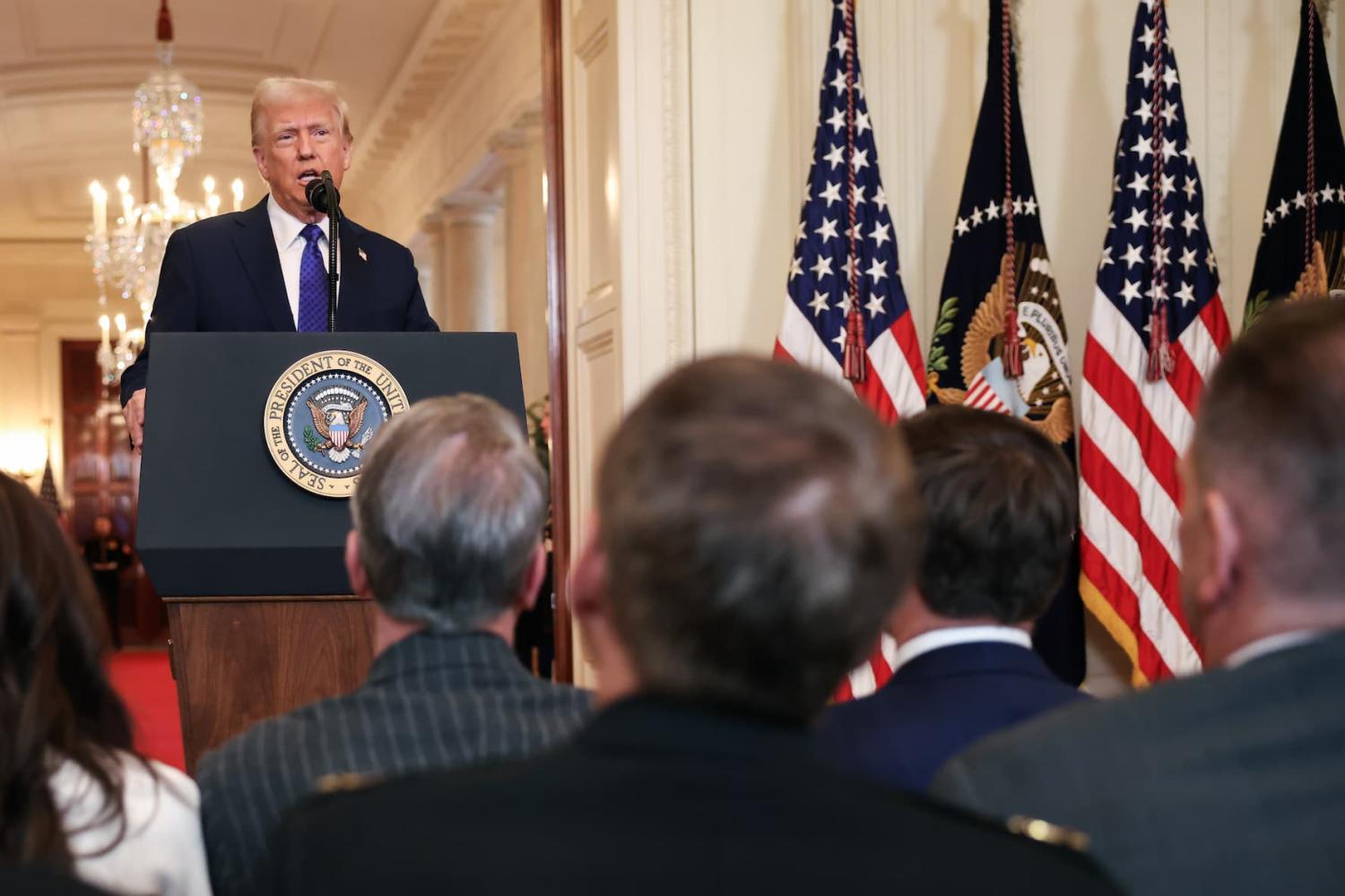 United States President Donald Trump speaks during an event in the East Room of the White House on January 29, 2025 in Washington, D.C. The Laken Riley Act is the first bill signed by President Trump in his new administration. It is named after a slain Georgia nursing student and would require the detention of unauthorized immigrants that have been accused of theft and violent crimes.