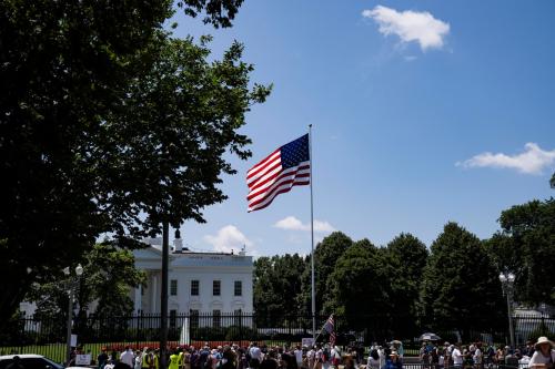 A group protests outside the White House against Trump's visa ban on refugees and immigrants who come to the U.S. for school in Washington, D.C., on June 20, 2025.