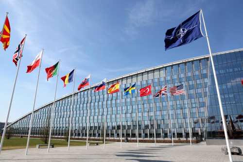 National flags of NATO members flutter at the alliance's headquarters in Brussels, Belgium, April 2, 2025.