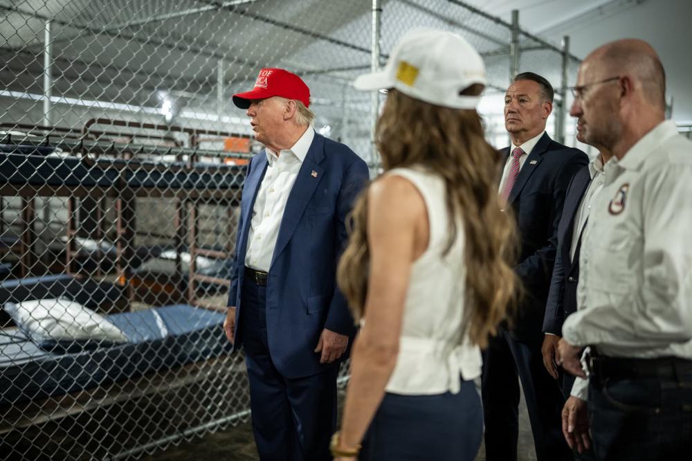 July 1, 2025, Ochopee, Florida, USA: President DONALD TRUMP, left, with Secretary of Homeland Security KRISTI NOEM and others, participates in a walking tour of the immigration detention center nicknamed “Alligator Alcatraz” Tuesday. (Credit Image: © Daniel Torok/White House/ZUMA Press Wire)