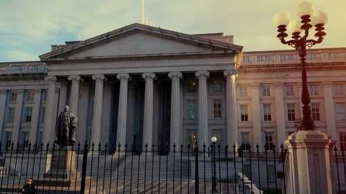 United States Department of the Treasury Building with the statue of Alexander Hamilton in Washington, DC,