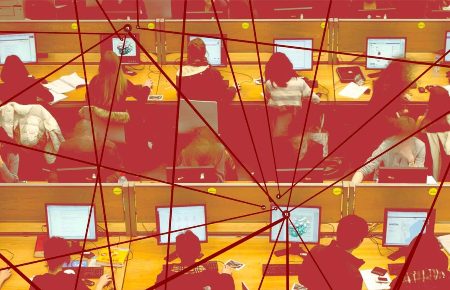 A computer lab with three rows of four desks, each occupied by students working at computers. Overlaying the computer lab are red lines connecting through nodes, symbolizing the flow of communication, data exchange, and interconnected networks.