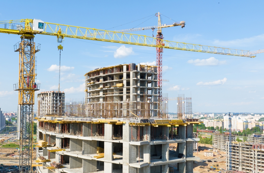 Construction,Crane,On,Housing.,Construction,Site,With,Buildings,Under,Construction.