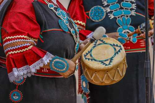 Zuni Native American plays drum in ceremony in Gallup, New Mexico Gallup, New Mexico, July 21, 2016 - Government Center Plaza