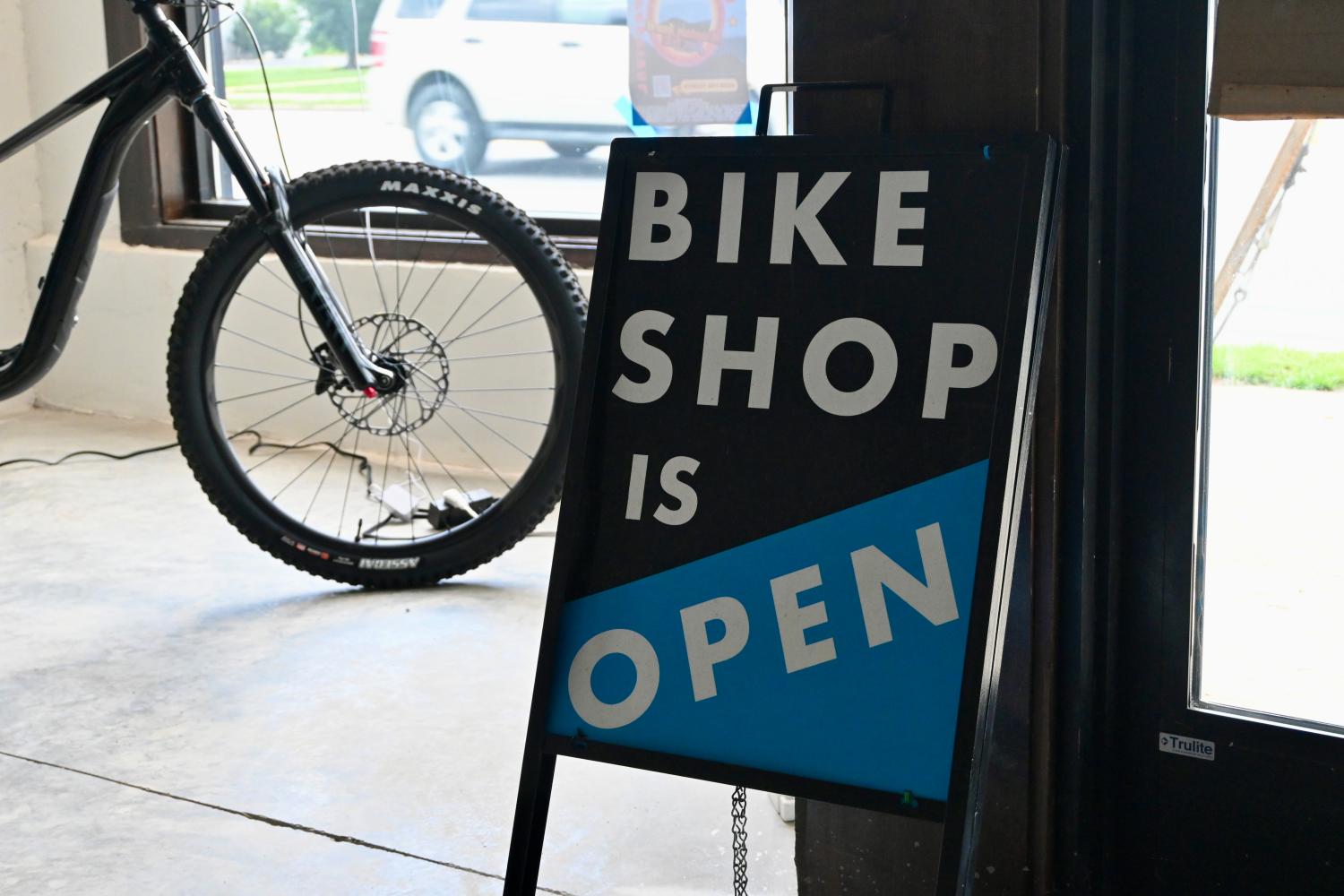 Sign reading "Bike Shop Is Open" in the Old Fort Bike Shop, Old Fort, North Carolina