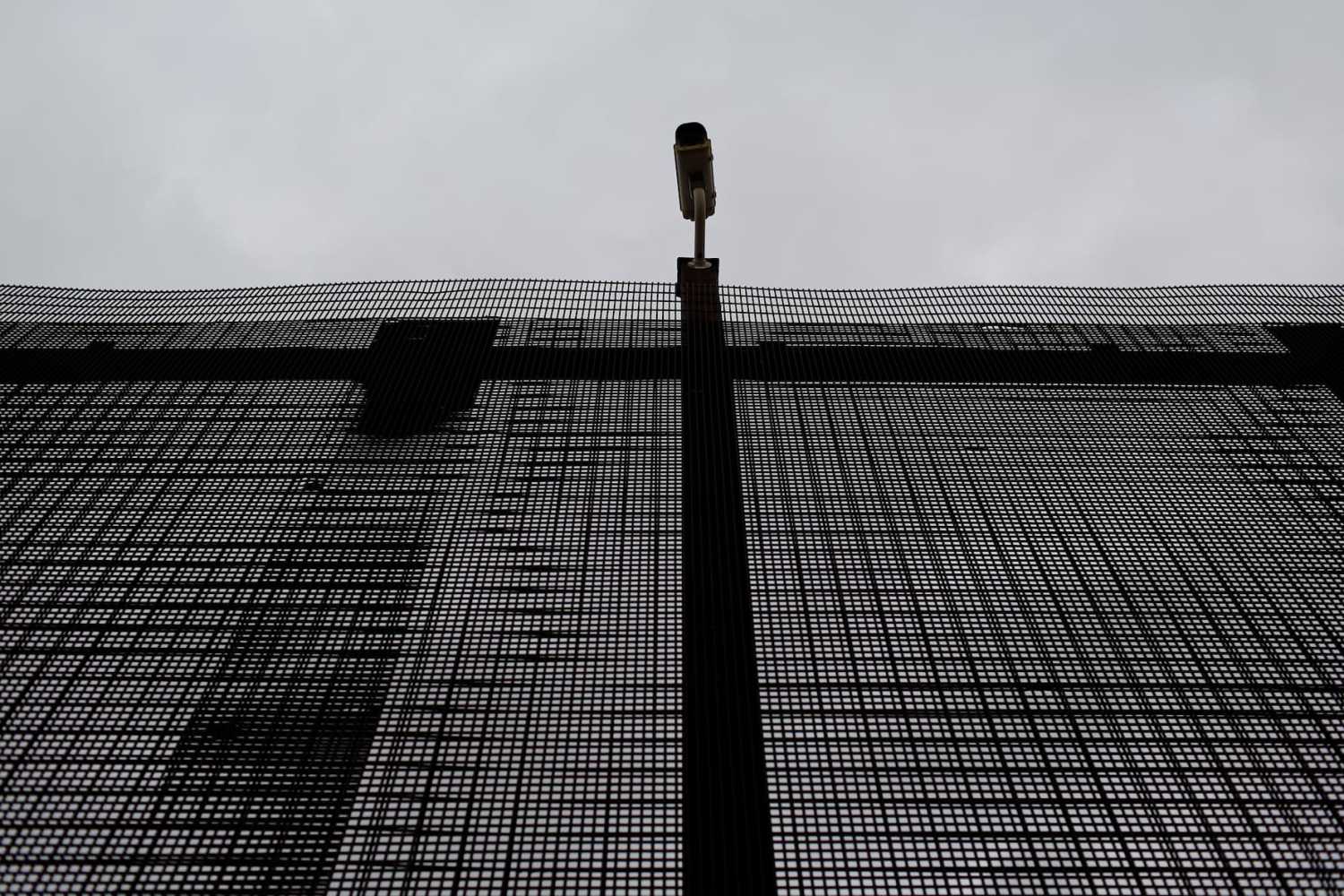 A surveillance camera is pictured atop the border fence separating the United States and Mexico in El Paso, U.S. January 17, 2017.