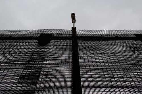 A surveillance camera is pictured atop the border fence separating the United States and Mexico in El Paso, U.S. January 17, 2017.