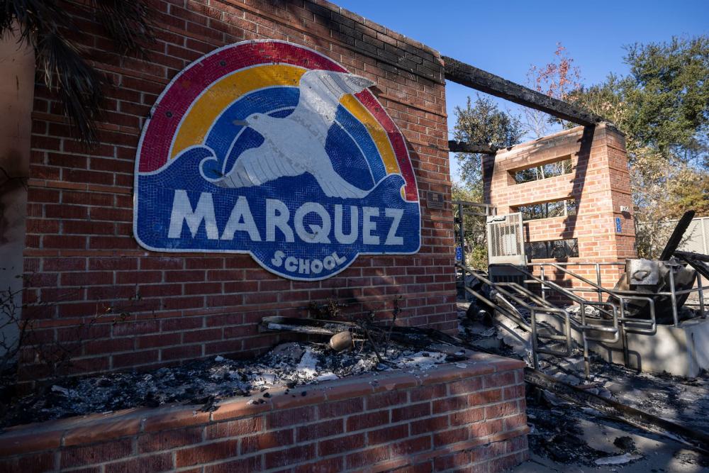 The sign of the Marquez School on the exterior of the destroyed school building during the aftermath of the Palisades Fire on January 15, 2025, in Los Angeles, California. The fires have scorched large swaths of Los Angeles.