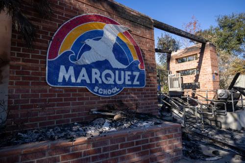 The sign of the Marquez School on the exterior of the destroyed school building during the aftermath of the Palisades Fire on January 15, 2025, in Los Angeles, California. The fires have scorched large swaths of Los Angeles.