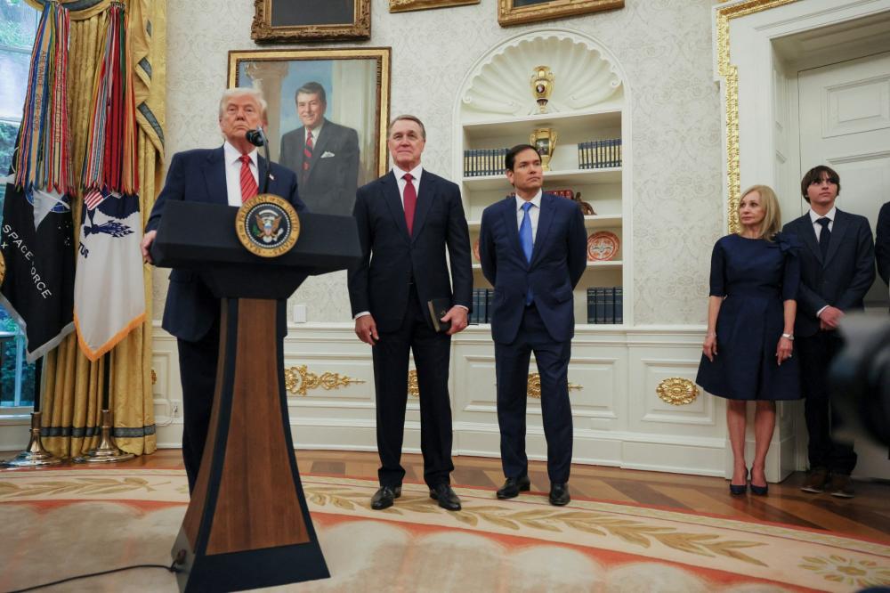 Trump swears in new U.S. ambassador to China David Perdue.