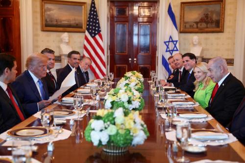U.S. President Donald Trump looks at a nomination letter after Israeli Prime Minister Benjamin Netanyahu told him he nominated him for the Nobel Peace Prize, during a bilateral dinner, with U.S. Defense Secretary Pete Hegseth and U.S. Secretary of State Marco Rubio in attendance, at the White House in Washington, D.C., U.S., July 7, 2025.