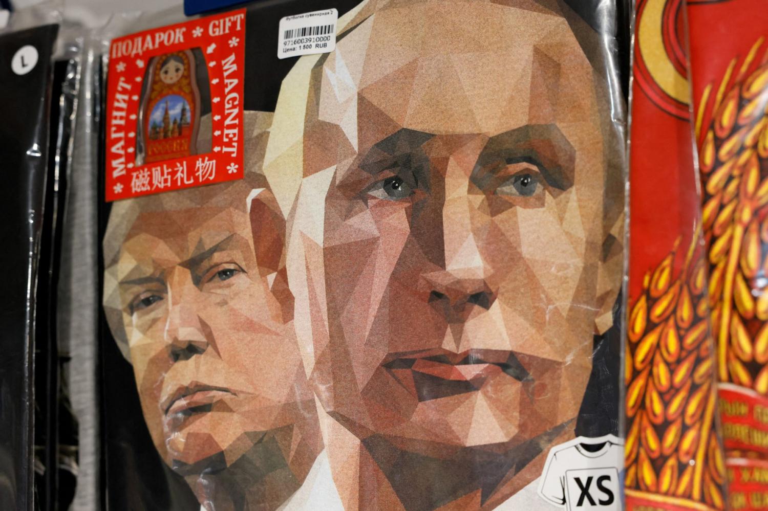 T-shirts with images of Russian President Vladimir Putin and U.S. President Donald Trump are displayed for sale at a gift shop in central Moscow, Russia, August 12, 2025.
