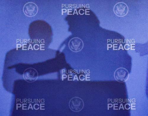 The shadows of U.S. President Donald Trump and Russian President Vladimir Putin are cast during a press conference following their meeting to negotiate an end to the war in Ukraine, at Joint Base Elmendorf-Richardson, in Anchorage, Alaska, U.S., August 15, 2025.