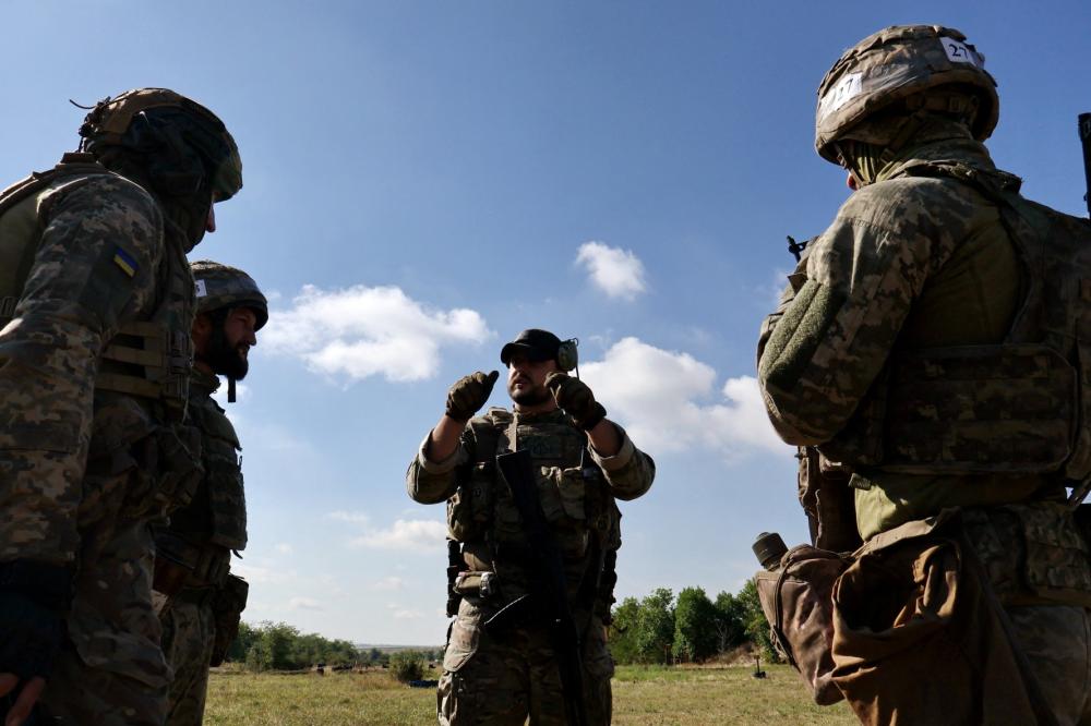 Recruits of the 65th Separate Mechanized Brigade of the Ukrainian Armed Forces attend a military drill near a frontline, amid Russia's attack on Ukraine, in Zaporizhzhia region, Ukraine August 25, 2025.