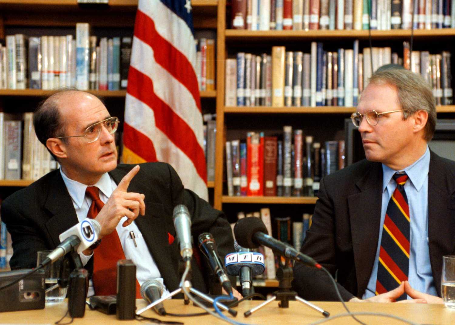 U.S. Deputy Secretary of State Strobe Talbott (L) and U.S. Ambassador to Macedonia Cristopher Hill (R) talk during a press conference in the American Embassy in Skopje, April 4, 1999.