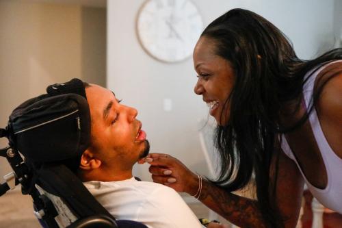 Esther JeanBart, mother of Gianni, takes cares of her son, Gianni JeanBart, 24, at their home on Thursday, April 11, 2024, in Valrico, Florida.