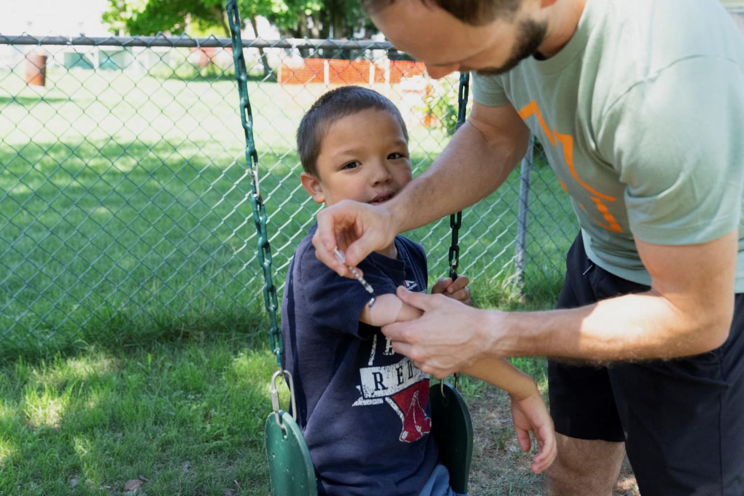 Kirill Zenchenko gives his son Pax, who has diabetes, an insulin shot at their home in Chicopee, Massachusetts, U.S., on July 26, 2024.