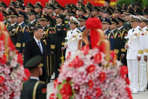 Chinese President Xi Jinping walks past members of the Chinese People's Liberation Army (PLA) as he arrives for a ceremony to commemorate Martyrs' Day, on the eve of the 75th founding anniversary of the People's Republic of China, on Tiananmen Square in Beijing, China September 30, 2024.