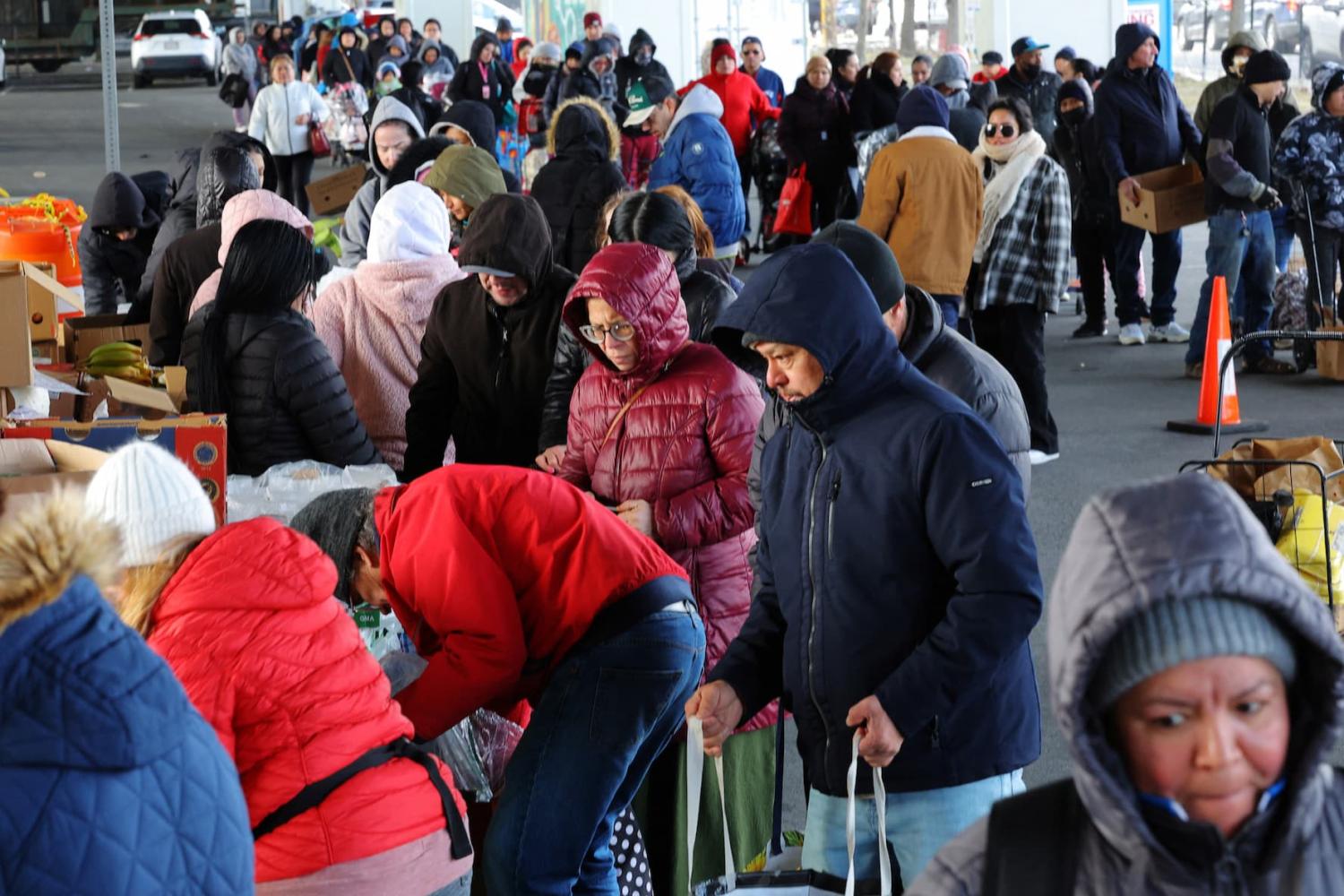 Residents pick up free groceries at La Colaborativa's food pantry in the Boston suburb of Chelsea, Massachusetts, U.S., on March 12, 2025.
