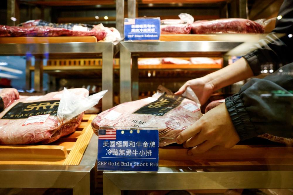 A staff member organizes U.S. imported beef at a supermarket, as the U.S. prepares to announce trade tariffs on Taiwan, in Taipei, Taiwan, July 31, 2025. REUTERS/Ann Wang