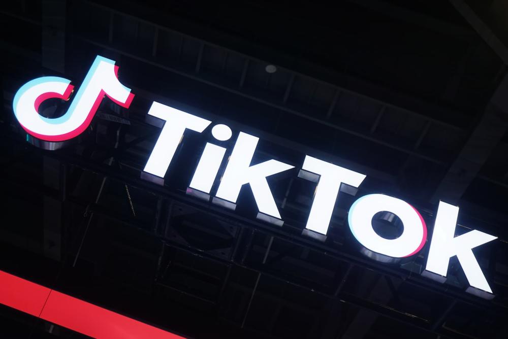 The TikTok logo displayed against a black background.