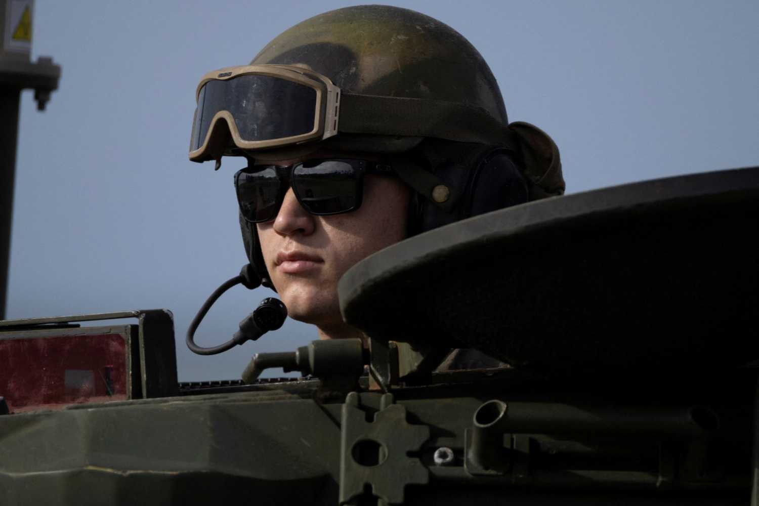 A U.S. Marine looks out from an armored vehicle during training in Arroyo, Puerto Rico, September 25, 2025.