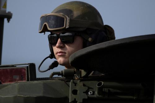 A U.S. Marine looks out from an armored vehicle during training in Arroyo, Puerto Rico, September 25, 2025.