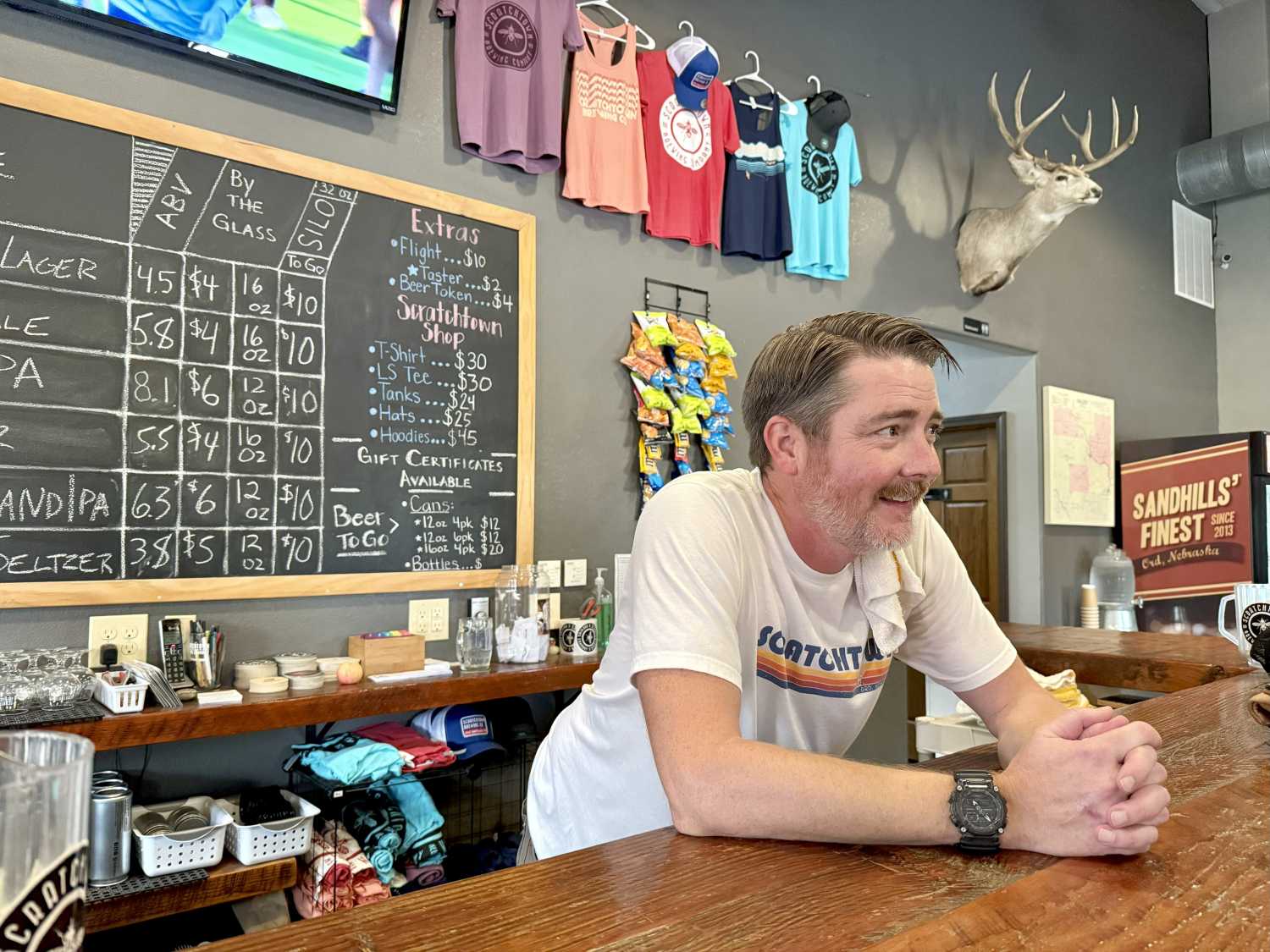 At the bar inside Scratchtown Brewing, with Caleb Pollard, in Ord, Nebraska.