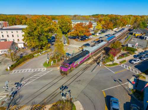 CONCORD, MA, USA - OCT. 11, 2022: MBTA Commuter Rail stops at West Concord depot in town of Concord, Massachusetts MA, USA.