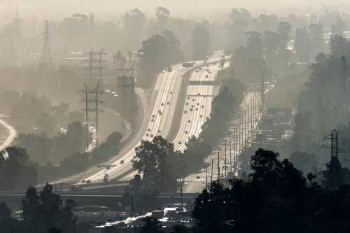 Hazy smoggy view of the 5 freeway near Riverside Drive, Griffith Park and the Los Angeles River in Southern California.