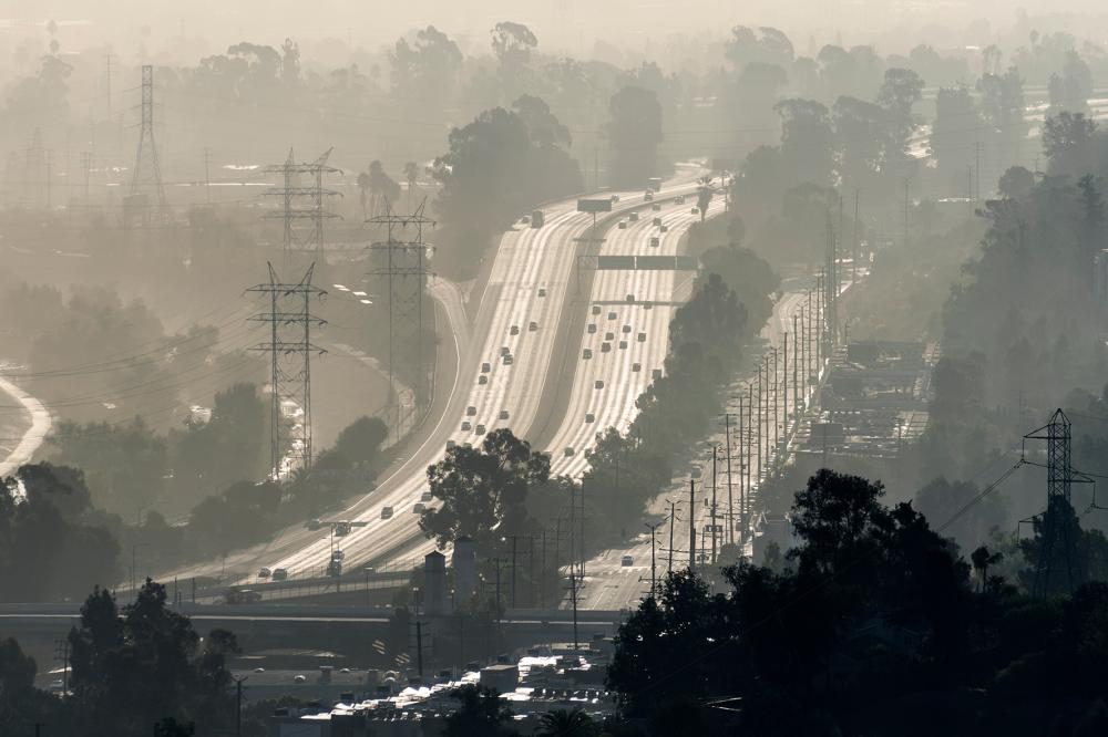 Hazy smoggy view of the 5 freeway near Riverside Drive, Griffith Park and the Los Angeles River in Southern California.