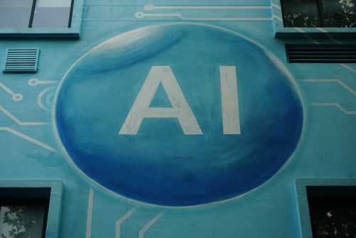 A mural on the side of a building with "AI" written in the center of a blue sphere.