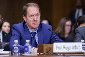 Professor Roger Alford testifies during a hearing with Visa and Mastercard executives regarding swipe fees, in the Capitol Building in Washington, DC.