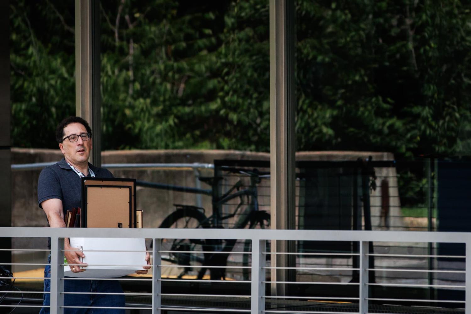 A man leaves the U.S. Department of State with a box of his belongings on July 11, 2025 in Washington, D.C. The State Department issued the first of 1,800 layoffs today after a court ordered ban was lifted by the U.S. Supreme Court. (Photo by Samuel Corum/Sipa USA)