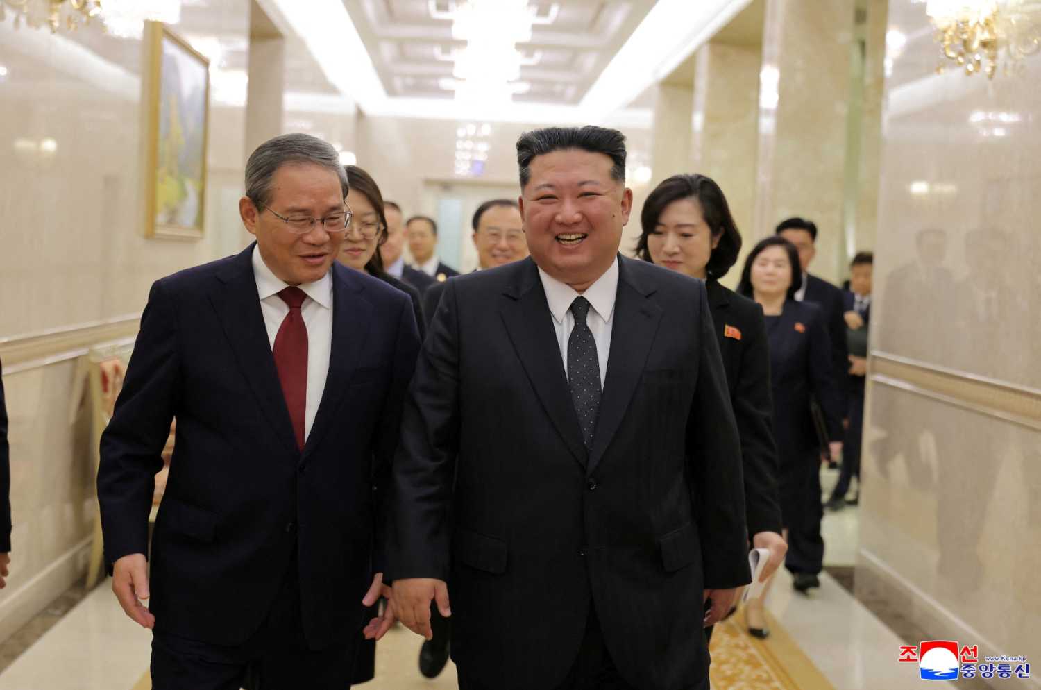 China’s Premier Li Qiang and North Korean leader Kim Jong Un walk as they meet on the day of an event marking the 80th anniversary of the founding of the ruling Workers' Party of Korea (WPK), in Pyongyang, North Korea, October 9, 2025, in this pictured released October 10, 2025 by North Korea's official Korean Central News Agency.