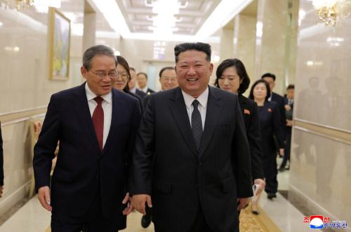 China’s Premier Li Qiang and North Korean leader Kim Jong Un walk as they meet on the day of an event marking the 80th anniversary of the founding of the ruling Workers' Party of Korea (WPK), in Pyongyang, North Korea, October 9, 2025, in this pictured released October 10, 2025 by North Korea's official Korean Central News Agency.