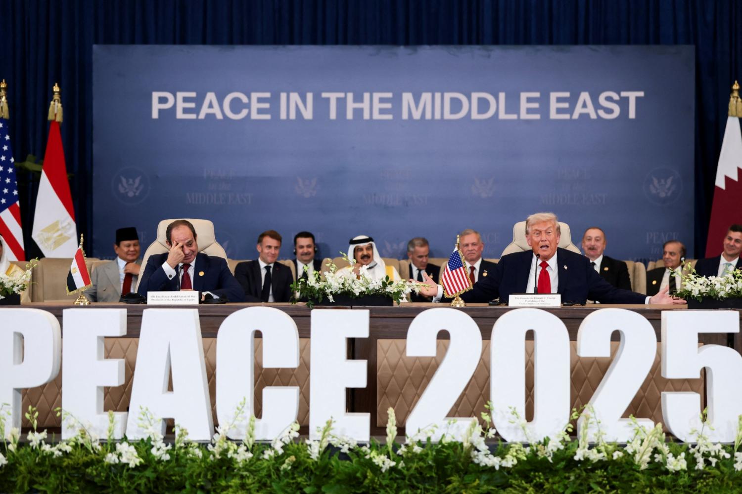 U.S. President Donald Trump speaks next to Egyptian President Abdel Fattah el-Sisi as they atttend the official signing of the first phase of the Gaza ceasefire agreement between Israel and Hamas, in Sharm El-Sheikh, Egypt, October 13, 2025.