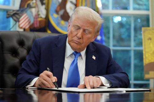 FILE PHOTO: U.S. President Donald Trump signs an executive order on gold card visa in the Oval Office at the White House in Washington, D.C., U.S., September 19, 2025. REUTERS/Ken Cedeno//File Photo