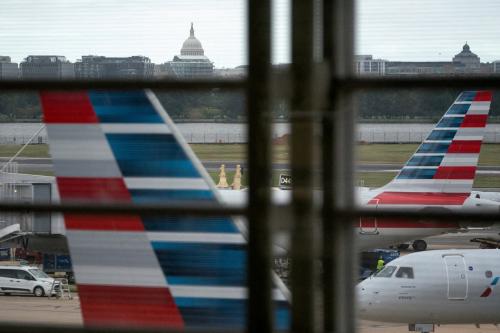 American Airlines flights stage on the tarmac at Reagan Washington National Airport as the U.S. government shutdown continues in Arlington, Virginia, U.S., on Oct. 8, 2025.