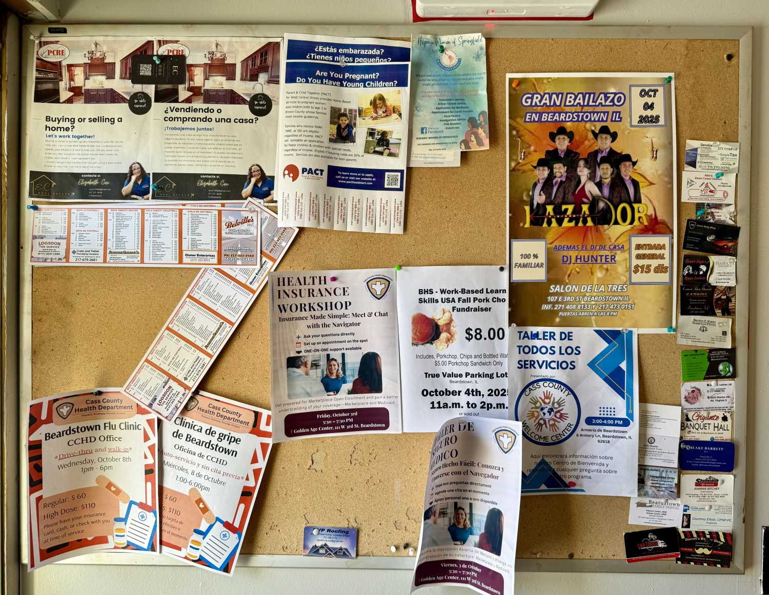 Bulletin board with notices in multiple languages, Beardstown, Illinois.