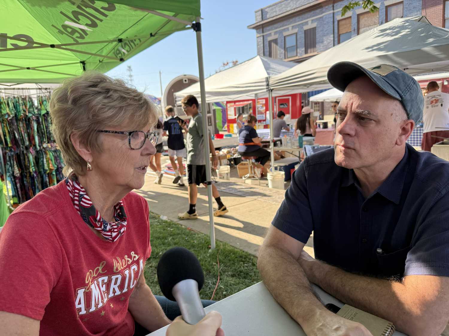 Resident Buffy Tillitt-Pratt talks with host Tony Pipa at the Fall Fun Fest in Beardstown, Illinois